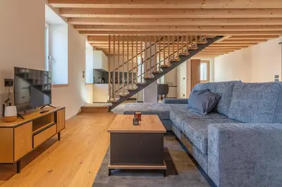 a living room with a couch and a table at Duplex Cermis in Cavalese