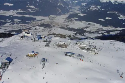 a group of people on a ski slope in the snow at Berghaus-Olymp Kronplatz in Brunico