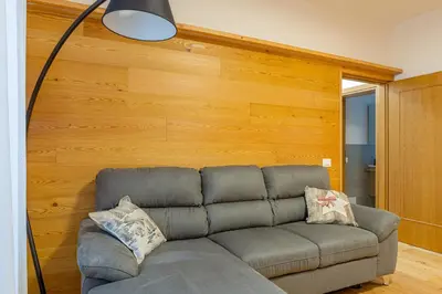 a meeting room with a table and a sink at DE Earth - Appartamento con Sauna in Caprile