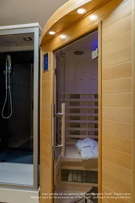 a corner of a sauna with towels in it at DE Earth - Appartamento con Sauna in Caprile