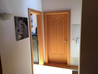 an open door in a room with a mirror at Ferienwohnung im schönen Südtirol in Fiumes
