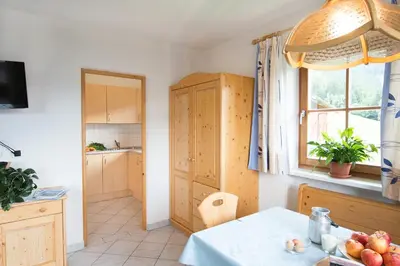 a kitchen with a table with fruit on the table at Bärntalerhof in Falzes