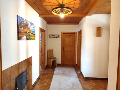 a living room with a fireplace and a wooden ceiling at Almliesl THUR-746 in Lovara