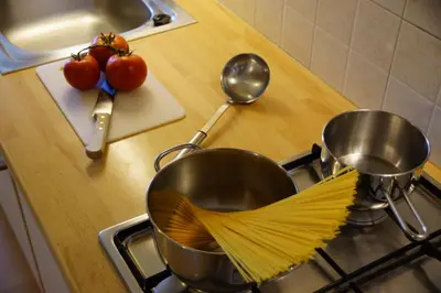 a kitchen with two pots on a stove at Plaön Apartments in La Villa