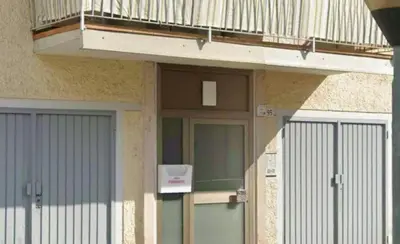 a balcony on top of a building with a door and a balcony at CasaFlavondiBolzano in Bolzano