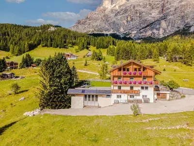 an aerial view of a house in the mountains at Garni Baita in San Cassiano
