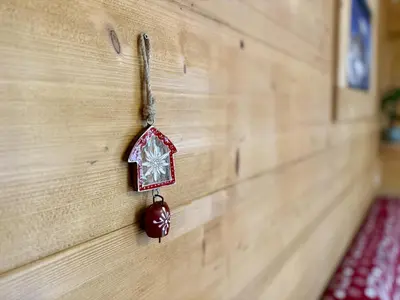 a wooden wall with a toy house on it at Dolomites Red Heart Lake View in Masarè