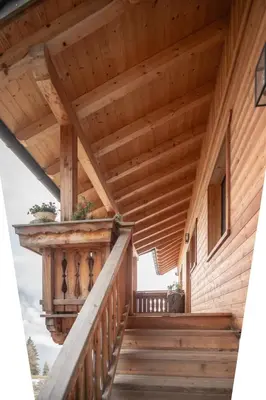 a large wooden house in the snow at Urlaub auf den Bauernhof Brunnerhof in Floronzo