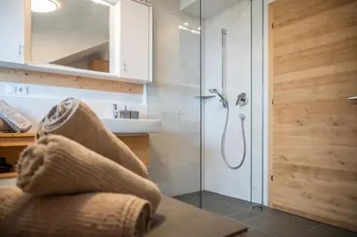 a bathroom with a shower and a sink at Urlaub auf den Bauernhof Brunnerhof in Floronzo