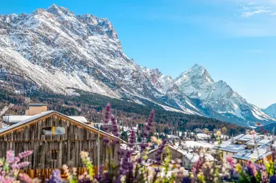 a view of a town with mountains in the background at Chalet Mortisa, Cortina design apartment in Col