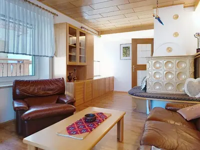 a living room with a couch and a table at Apartment Cesa Marco by Interhome in Pozza di Fassa