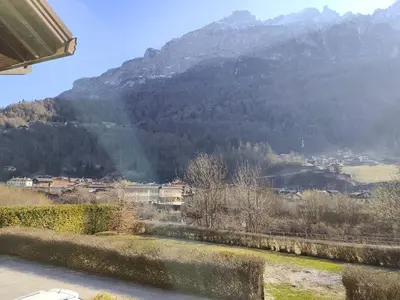 a view of a snow covered field from a window at Angolo relax in Cencenighe