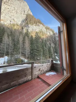 a window with a view of a mountain at Malga Ciapela e Marmolada a due passi dalle piste in Malga Ciapela