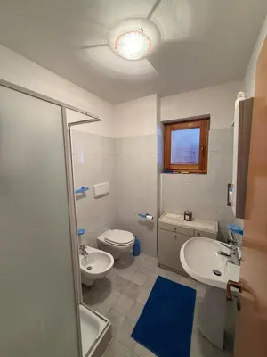 a bathroom with a toilet and a sink and a shower at Malga Ciapela e Marmolada a due passi dalle piste in Malga Ciapela