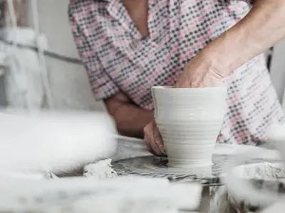 a potter making a bowl on a pottery wheel at Terra - The Magic Place Relais & Châteaux in Sarntal