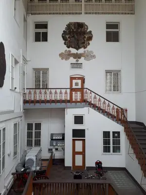 a bedroom with a large white bed in it at Appartamenti Duomos in Merano