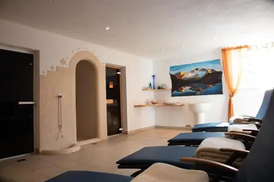 a room with a row of yoga mats in a room at Gasthof Innerwalten in San Leonardo in Passiria