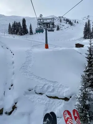a pair of snowboards and a ski lift in the snow at Gasthof Innerwalten in San Leonardo in Passiria