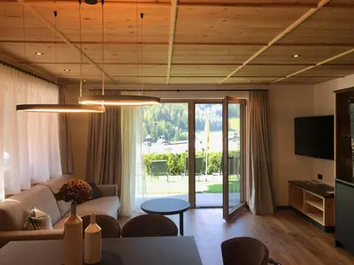 a living room with a couch and a table at Pra Ciarea Apartments in Ortisei