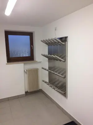 a empty room with a window and a shelf at Pra Ciarea Apartments in Ortisei