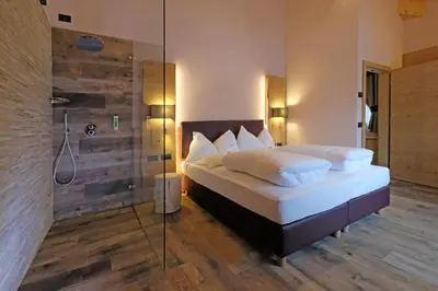 a bathroom with a sink and a shower at Vidor Resort in Pozza di Fassa