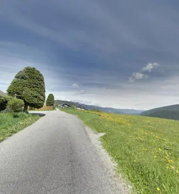 a road in the middle of a field at Residence Condor in Maranza