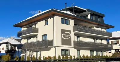 a building with balconies on the side of it at B&B Obermair in Brunico