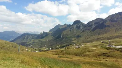 a view of a valley in a mountain range at Hotel Nevada in Campitello di Fassa