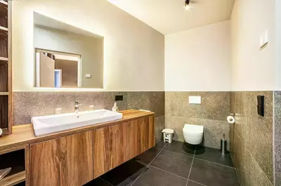 a bathroom with a sink and a toilet at Appartements König in Merano