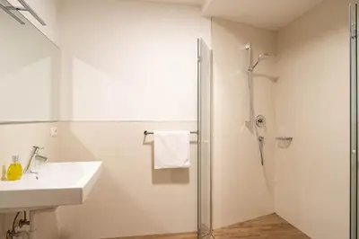 a bathroom with a sink and a shower at Landhaus am Gries in Lana