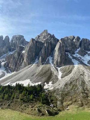 a mountain with trees and snow on it at Appartamenti la Fontana in San Martino in Badia