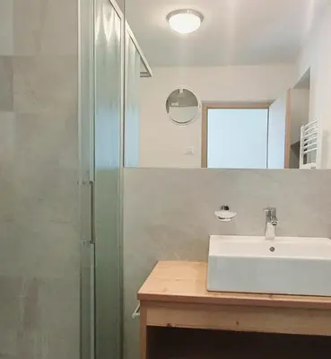 a bathroom with a sink and a shower at Residence Majarai in Colfosco