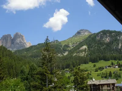 a view of a valley in the mountains at Garni Festil in Campitello di Fassa