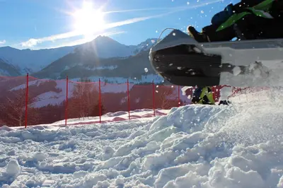 a person on a snowboard standing in the snow at Pension Widmann in Stulles