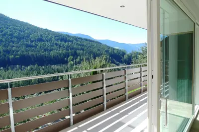 a balcony with a view of the mountains at Villa Ried in Perca