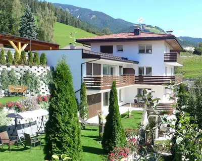 a house with a garden in front of it at Villa Ried in Perca