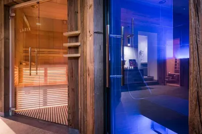 a window of a store with blue lights on it at Garni Larix in Colfosco