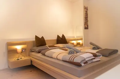 a bedroom with two beds in a room at Partschillerhof in Fiè
