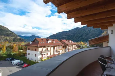 a view from the balcony of a building with mountains in the background at Isarco Suite in Vipiteno