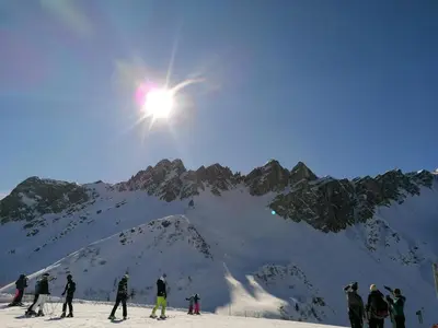 a group of people skiing on a snow covered mountain at Villa Alessandra in Colle Isarco