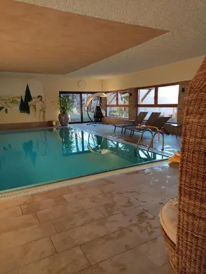 a large swimming pool in a house at Prünsterhof Schenna in Schenna