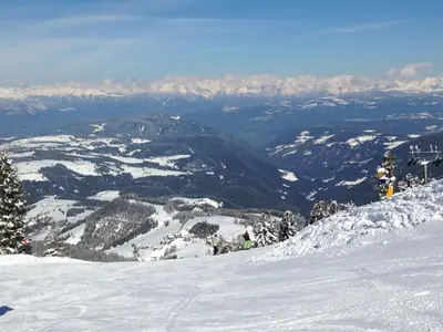 a view of a snowy mountain with mountains in the background at Alps Residence in Nova Ponente