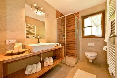 a bathroom with a sink and a shower and a toilet at Tratterhof Apartments in Vallarga
