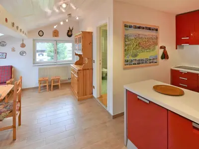 a kitchen and living room with a table and chairs at Apartment Apt 41 by Interhome in Alba di Canazei