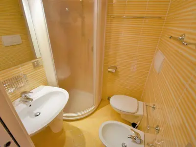 a bathroom with a sink and a toilet and a shower at Apartment Apt 41 by Interhome in Alba di Canazei