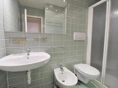 a bathroom with a sink and a toilet at Apartment Apt 41 by Interhome in Alba di Canazei