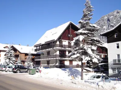 a large building with a snow covered roof at Apartment Apt 41 by Interhome in Alba di Canazei