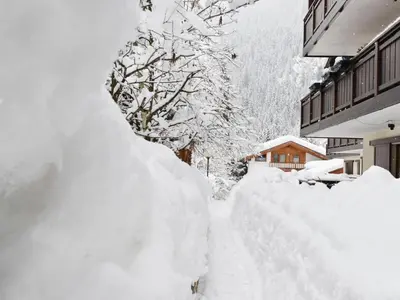 a pile of snow on the side of a building at Studio Apt 14 by Interhome in Alba di Canazei
