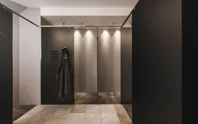 a room with a coat hanging on a wall at Hotel Steger-Dellai in Alpe di Siusi