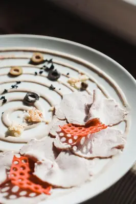 a plate of food on a table with food on it at Hotel Mitlechnerhof in Schenna